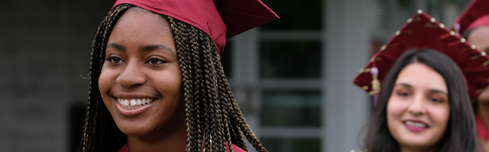 Two students line up on graduation day
